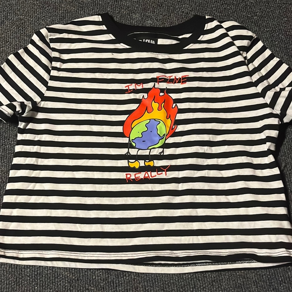 black and white striped shirt with a burning earth on it good condition size s